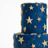 Top tier of luxury contemporary, customisable, celebration cake, Cosmos Star by Decorum Taste, in deep blue with flecks of edible gold and golden stars.