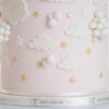 Bottom of luxury contemporary, customisable, celebration cake, Cute Elephant by Decorum Taste, in blush pink with embellishments of clouds, stars and hearts. The side of the cake board is wrapped in a ribbon with the Decorum Taste logo.