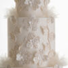 Sequinned floral decorative detail and delicate rice paper ruffles on the 4 tier luxury customisable wedding cake, Daphne, by Decorum Taste.