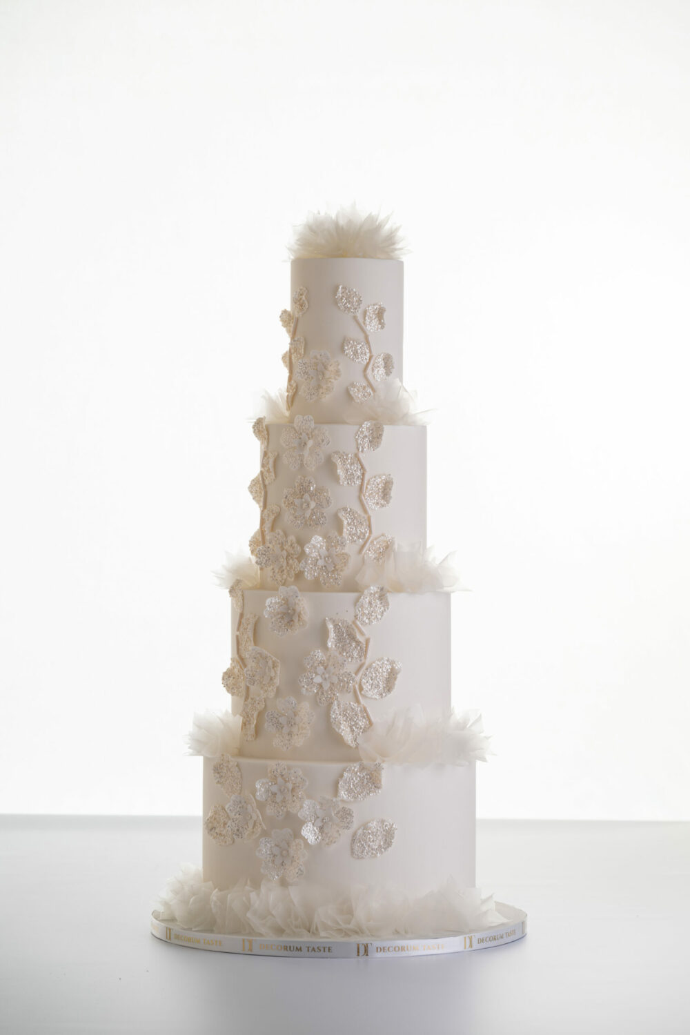 4 tier luxury customisable wedding cake, Daphne by Decorum Taste with sequin floral decorative detailing and rice paper ruffles.