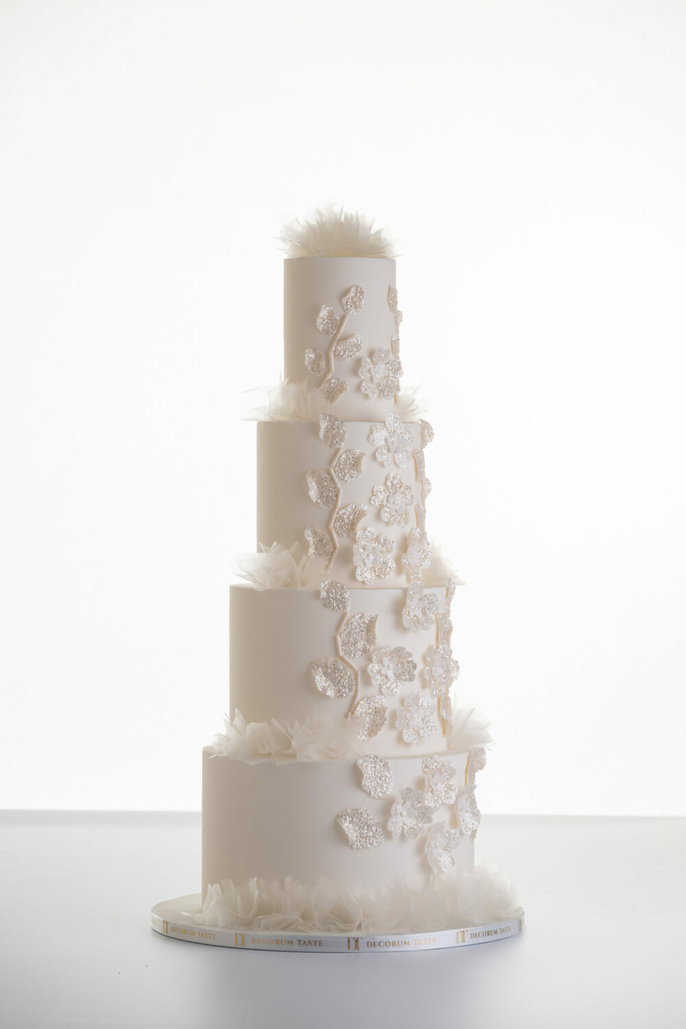 4 tier luxury customisable wedding cake, Daphne by Decorum Taste with sequin floral decorative detailing and rice paper ruffles.