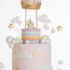 Top tier of luxury contemporary, customisable celebration cake, Floating Unicorn by Decorum Taste, decorated in blush pink with embellishments of white clouds, stars and a unicorn at the top sitting in a pastel coloured hot air balloon.