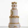 Four tier luxury customisable wedding cake in ivory with gold decorative details by Decorum Taste.