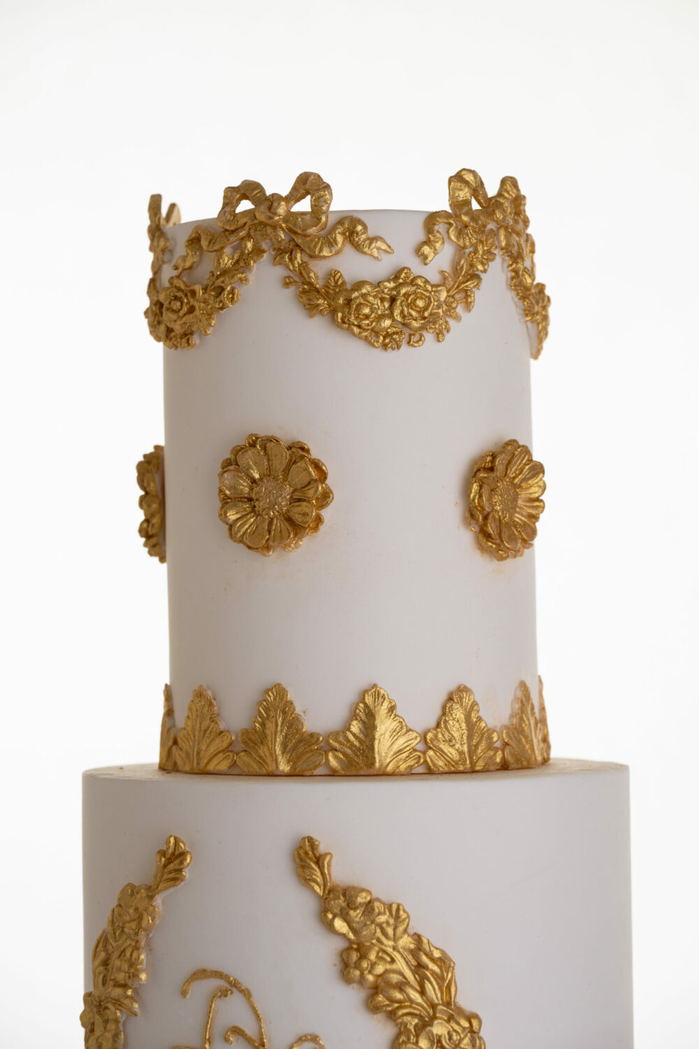 Elegant top two tiers of modern luxury customisable wedding cake, Lilibet, with gold decorative details, by Decorum Taste.