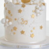 Detail of luxury contemporary, customisable, celebration cake, Moon Baby by Decorum Taste, in ivory with stars and clouds.