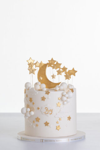 Single tier luxury contemporary, customisable, celebration cake, Moon Baby by Decorum Taste, in ivory with large golden moon, stars and clouds.