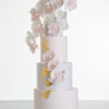 Four tier luxury contemporary, customisable, wedding cake, Orchid Heaven by Decorum Taste, with alternate tiers in blush pink and ivory, brushes of edible gold leaf and cascades of hand-crafted sugar orchids.