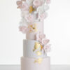 Four tier luxury contemporary, customisable, wedding cake, Orchid Heaven by Decorum Taste, with alternate tiers in blush pink and ivory, brushes of edible gold leaf and cascades of hand-crafted sugar orchids.