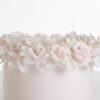 Single tier luxury contemporary, customisable, celebration cake, Ring of Roses by Decorum Taste, in blush pink with ring of hand-crafted sugar roses and petals at the top.