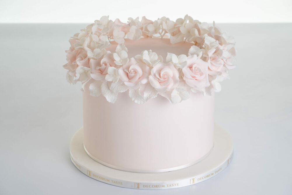 Single tier luxury contemporary, customisable, celebration cake, Ring of Roses by Decorum Taste, in blush pink with ring of hand-crafted sugar roses and petals at the top.