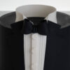 Top view of luxury contemporary, customisable, celebration cake, Tux Gent by Decorum Taste decorated in black the white of a formal shirt, tuxedo jacket and bow tie.